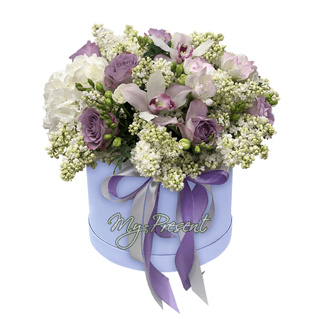 Lilac, roses, orchids and hydrangea in a box